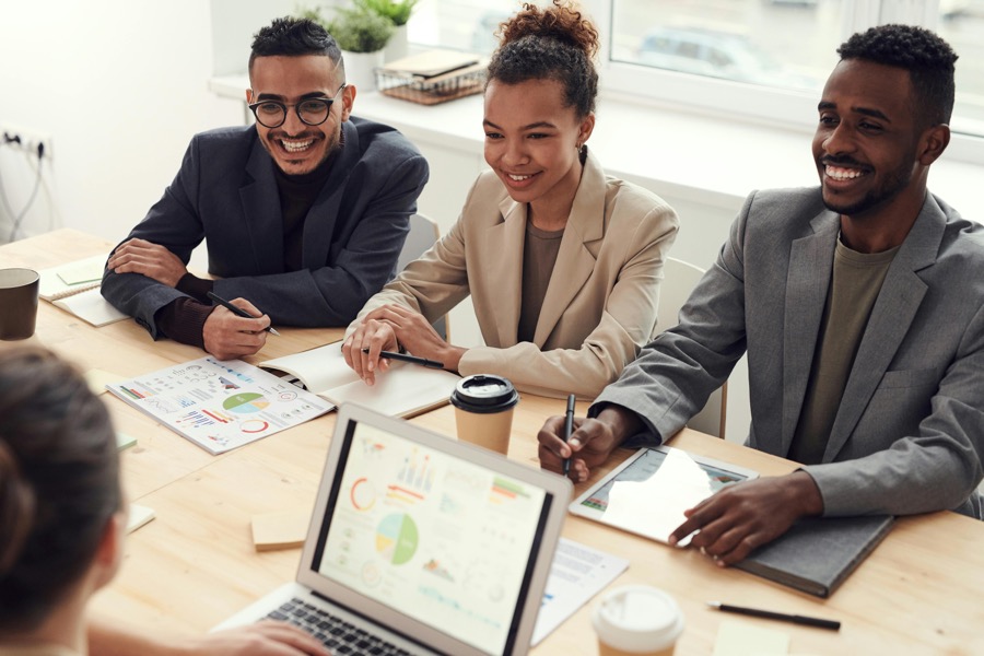 A Guyanese business team planning at a table
